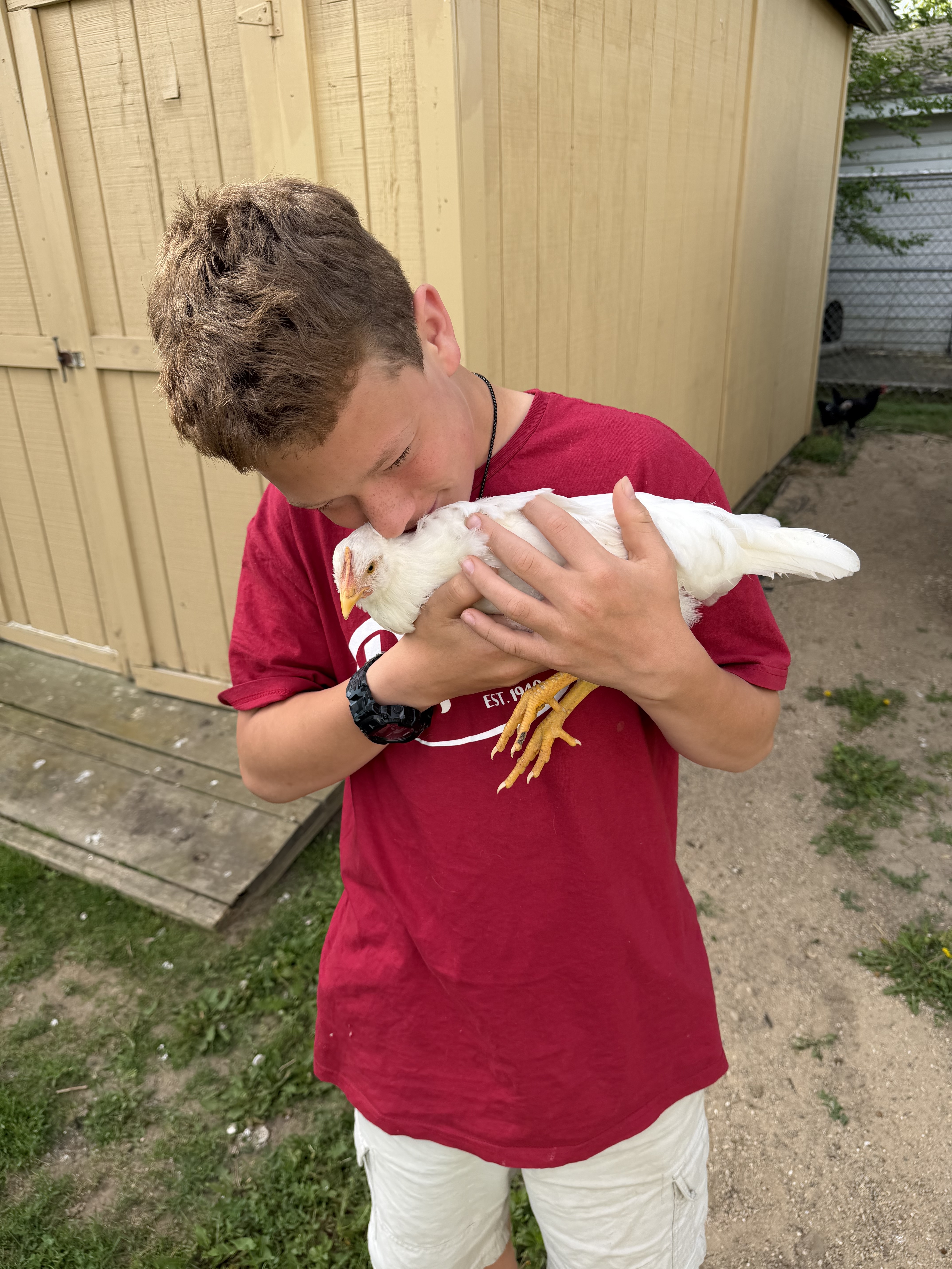 Caleb cuddling garlic